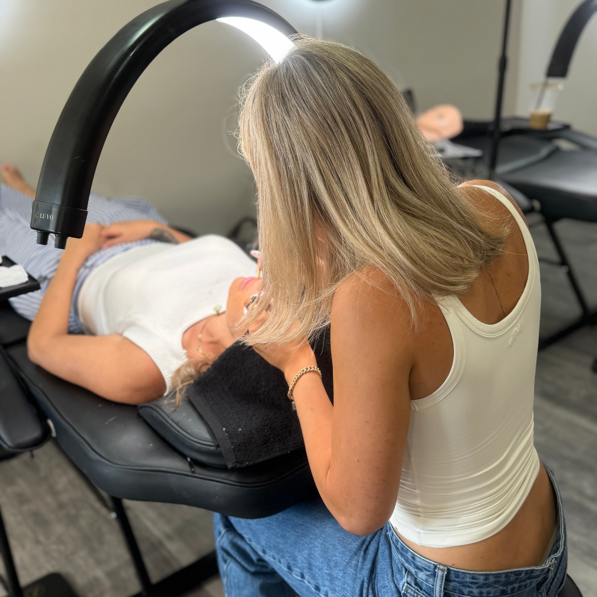 Person learning eyelash extensions